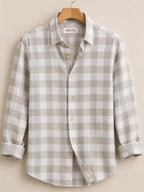 ROYYD tailored 100% linen shirt in natural beige, showing close-up of collar and fabric texture.