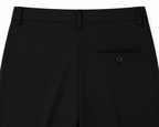 Black formal trousers by ROYYD, tailored fit with smooth fabric, shown on a hanger against a neutral background.