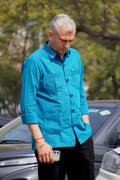 ROYYD premium teal blue linen hunting shirt displayed flat, showcasing its lightweight, breathable fabric and tailored design.